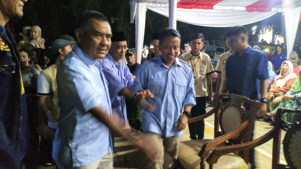 Turiman saat menyambut Supian Suri